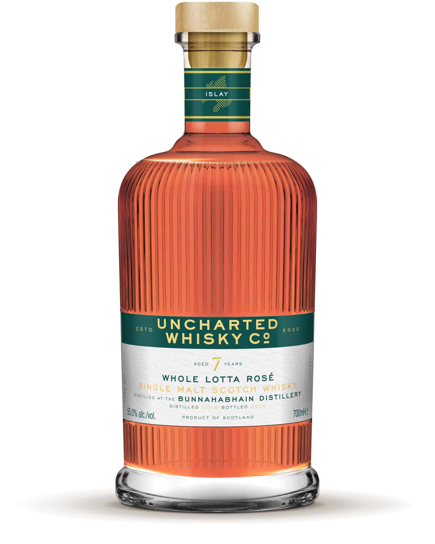 Uncharted Whisky Co. bottle with a green label on a white background