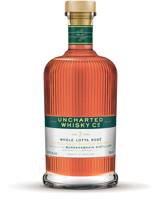 Uncharted Whisky Co. bottle with a green label on a white background