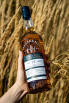Tri Carragh Aberfeldy 12 Year in hand, barley field